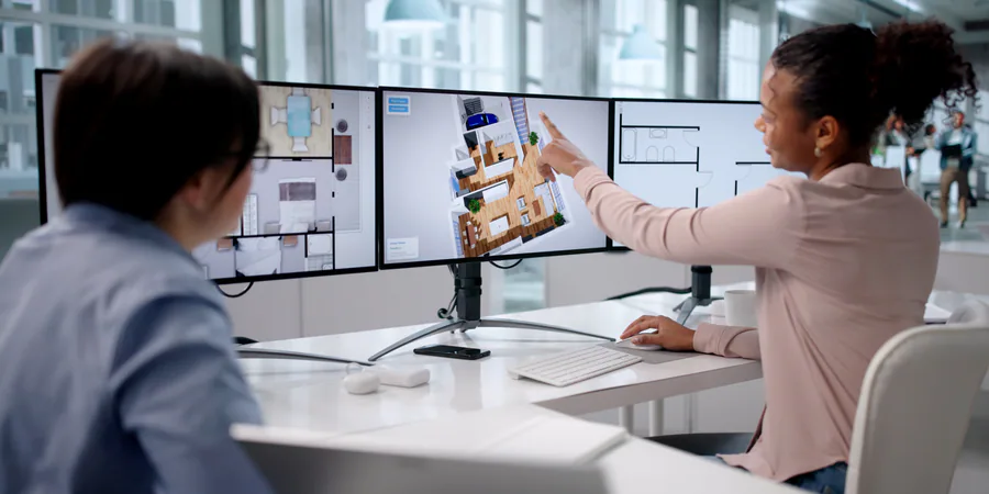Professional workstation with three screens on monitor arms